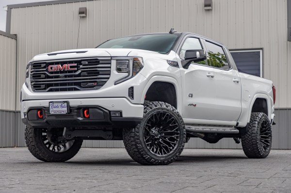 2022 GMC Sierra 1500 AT4 White with 6 inch rough country lift kit and 22x12 fuel strike wheels and 35" Nitto Ridge Grappler Tires