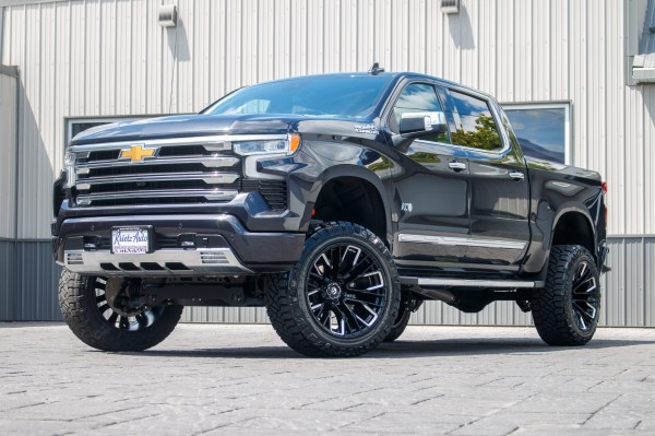2023 Chevrolet Silverado 1500 High Country Black with 6 inch rough country lift kit and 22x12 Fuel Rebar wheels and 35 inch Nitto Ridge Grappler Tires