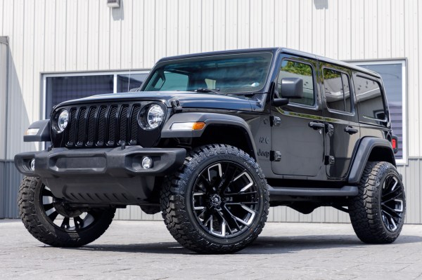 2022 Jeep Wrangler Unlimited Sport with a 2.5" Rough Country lift kit, 22x12 Fuel Rebar wheels, and 35" Fury Country Hunter R/T tires.