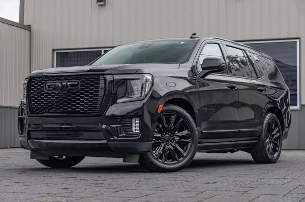 2023 GMC Yukon Denali Ultimate with GMC Factory suspension, 22x9 GMC Stock wheels, and Bridgestone Alenza tires.