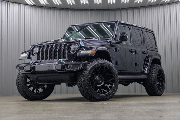 2022 Jeep Wrangler Unlimited Sahara 4XE with a 2.5" Rough Country lift kit, 22x12 Fuel Typhoon wheels, and 35" Fury Country Hunter R/T tires.