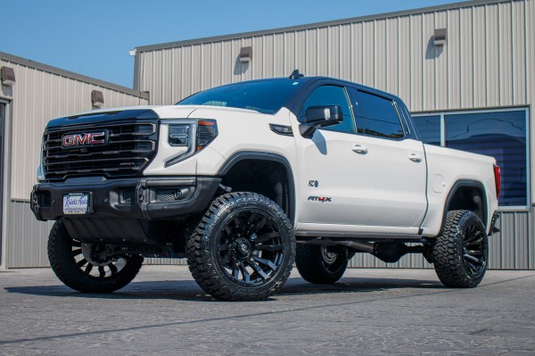 2024 GMC Sierra 1500 AT4X with a 4" ReadyLift lift kit, 22x12 Fuel Blitz wheels, 35" Fury Country Hunter R/T tires.