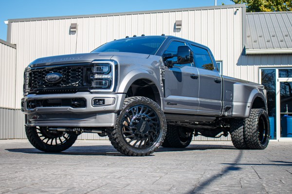 2024 Ford F-450 Super Duty Platinum with a 4" Wicked lift kit, 26x8.25 JTX Slayer wheels, and 37" AMP Terrain Attack M/T A tires.