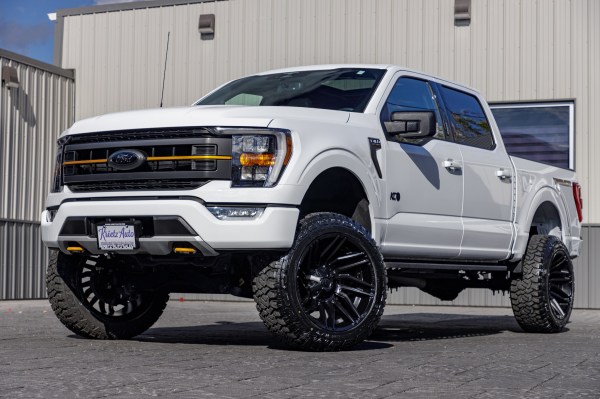 2023 Ford F-150 Tremor with a 6" Rough Country lift kit, 22x12 Fuel Typhoon wheels, and 35" Fury Country Hunter R/T tires.