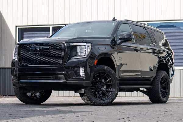 2024 GMC Yukon Denali with a 3" ReadyLift lift kit, 22x10 Fuel Catalyst wheels, and 295/50 Toyo Open Country AT3 tires.