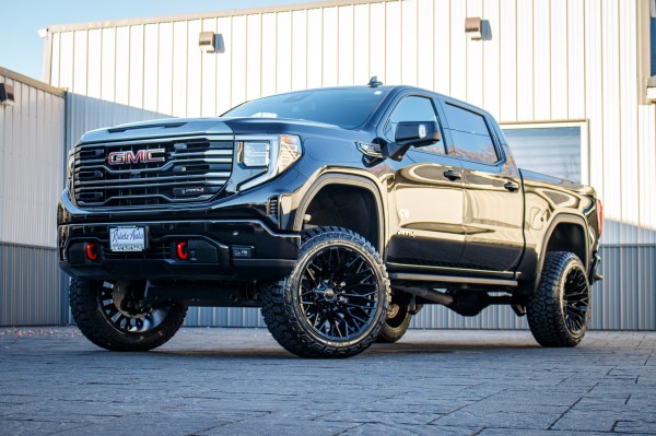 2024 GMC Sierra 1500 AT4 with a 6" Rough Country lift kit, 22x12 Fuel Strike wheels, and 35" Fury Country Hunter R/T tires.