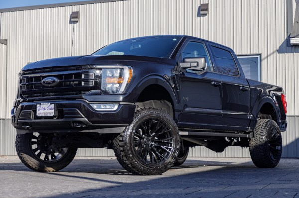 2023 Ford F-150 XLT with a 6" Rough Country lift kit, 22x12 Fuel Rebar wheels, and 35" Fury Country Hunter R/T tires.