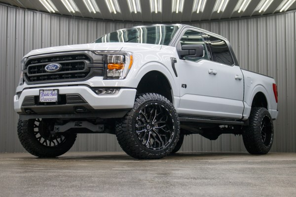2021 Ford F-150 XLT with a 6" Rough Country lift kit, 22x12 TIS 565BM wheels, and 35" Fury Country Hunter R/T tires.