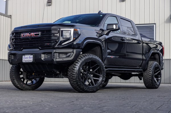 2023 GMC Sierra 1500 AT4X with a 4" ReadyLift lift kit, 22x12 Fuel Flux wheels, and 35" Fury Country Hunter R/T tires.