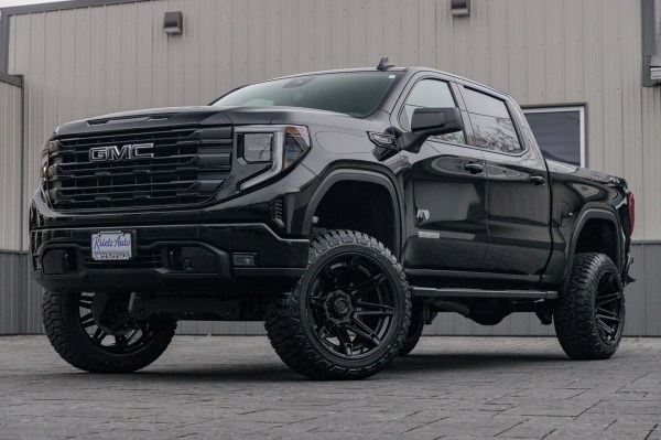 2024 GMC Sierra 1500 Elevation with a 6" Rough Country lift kit, 22x12 Fuel Brawl wheels, 35" Fury Country Hunter R/T tires.