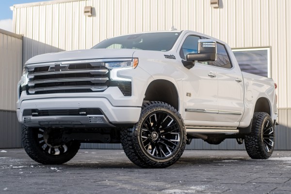2024 Chevrolet Silverado 1500 High Country with a 6" Rough Country suspension kit, 22x12 Fuel Rebar wheels, and 35" Fury Country Hunter R/T tires.