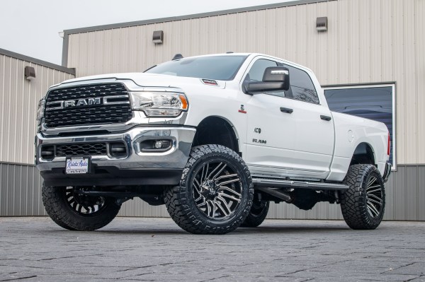 2024 Ram 2500 Big Horn with a 5" Rough Country lift kit, 22x12 Fuel Typhoon wheels, and 37" Nitto Ridge Grappler tires.