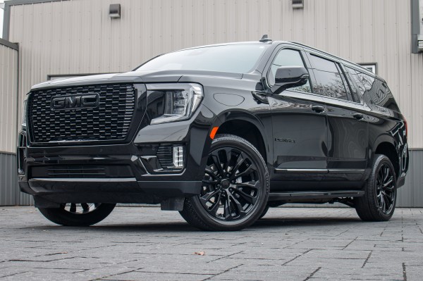 2024 GMC Yukon XL Denali with GMC Factory suspension, 20x9 GMC Stock wheels, and Bridgestone Alenza tires.