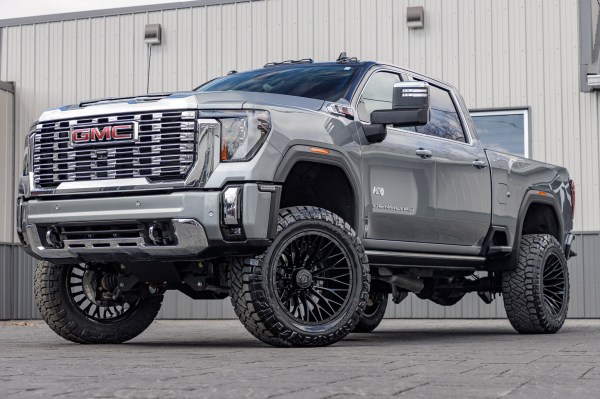 2024 GMC Sierra 2500 Denali with a 5" BDS lift kit, 22x12 TIS 566B wheels, and 37" Nitto Ridge Grappler tires.
