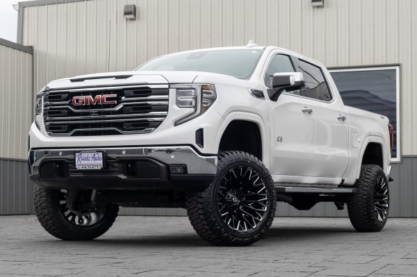 2022 GMC Sierra 1500 SLT with a 6" Rough Country lift kit, 22x12 Fuel Strike wheels, and 35" Fury Country Hunter R/T tires.