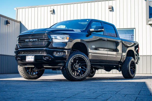 2024 Ram 1500 Laramie with a 6" Rough Country lift kit, 22x12 TIS 554B wheels, and 35" Fury Country Hunter R/T tires.