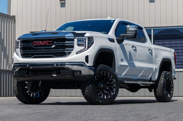 2024 GMC Sierra 1500 SLT with a 6" Rough Country lift kit, 22x12 Fuel Strike wheels, and 35" Fury Country Hunter R/T tires.