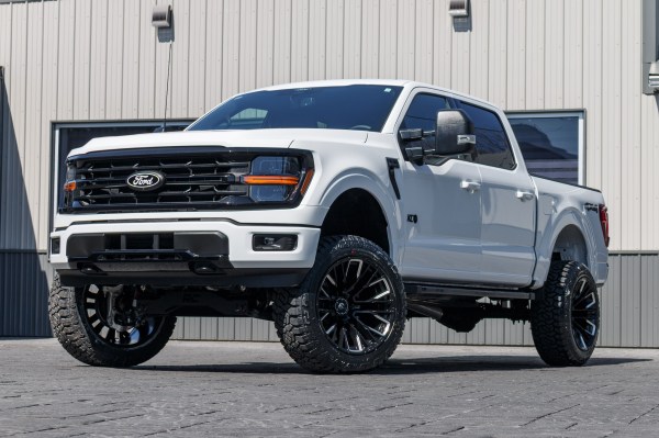 2024 Ford F-150 XLT with a 6" Rough Country lift kit, 22x12 Fuel Rebar wheels, and 35" Fury Country Hunter R/T tires.