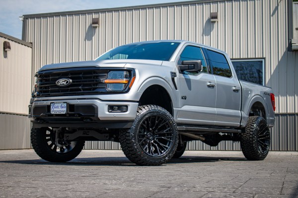 2024 Ford F-150 XLT with a 6" Rough Country lift kit, 22x12 Fuel Rebar wheels, and 35" Fury Country Hunter R/T tires.