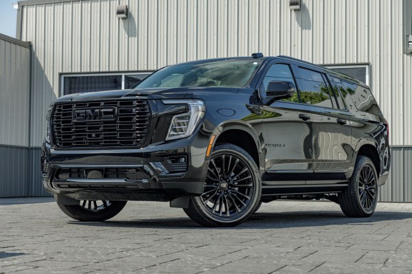 2025 GMC Yukon XL Denali with GMC Factory suspension, 22x9 GMC Stock wheels, and Bridgestone Alenza tires.