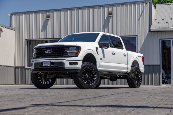 2024 Ford F-150 XLT with a 6" Rough Country lift kit, 22x12 Fuel Strike wheels, and 35" Avix Trailtek tires.
