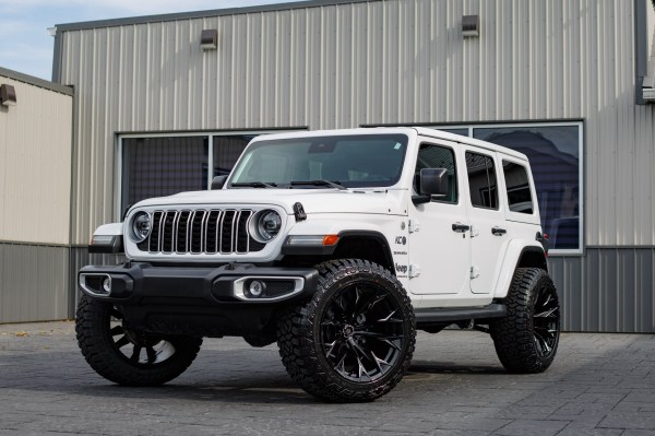 2024 Jeep Wrangler Sahara with a 2.5 Rough Country lift kit, 22x12 Fuel Flame wheels, and 35" Fury Country Hunter R/T tires.