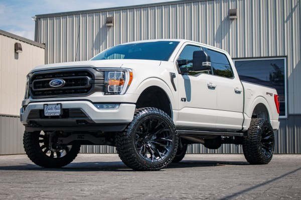 2023 Ford F-150 XLT with a 6" Rough Country lift kit, 22x12 Fuel Flame wheels, and 35" Avix Trailtek R/T tires.