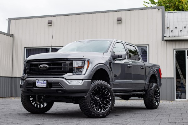 2023 Ford F-150 Lariat with a 6" Rough Country lift kit, 22x12 Fuel Strike wheels, and 35" Fury Country Hunter R/T tires.