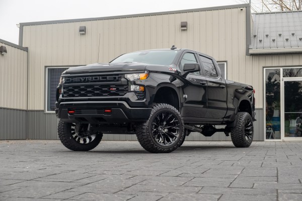 2025 Chevrolet Silverado 1500 Custom Trail Boss with a 6" Rough Country lift kit, 22x12 Fuel Flame wheels, and 35" Fury Country Hunter R/T tires.