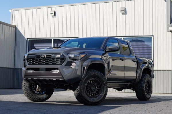 2025 Toyota Tacoma TRD Sport with a 3" ReadyLift lift kit, 18x9 KMC KM542 wheels, and 35" Avix Trailtek R/T tires.