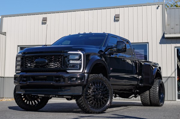 2025 Ford F-450 Super Duty Platinum with a 4" Wicked lift kit, 26x8.25 American Force Massive wheels, and 37" AMP Terrain Attack M/T A tires.