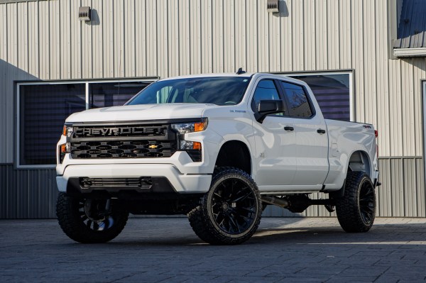 2025 Chevrolet Silverado 1500 Custom with a 6" Rough Country lift kit, 22x12 Fuel Flame wheels, and 35" Fury Country Hunter R/T tires.